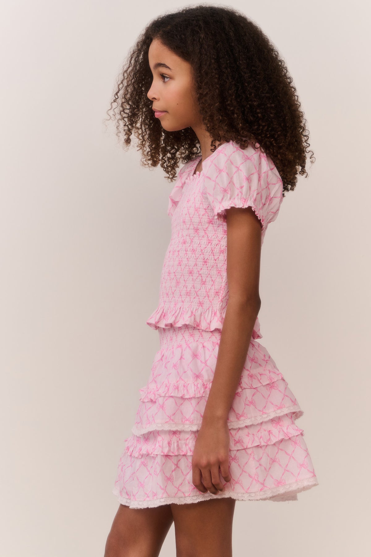 Pink lattice ruffle tier mini skirt with tiered ruffled layers