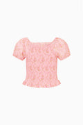 Pink floral tween top with square neckline, puff sleeves, smocked waist, ruffle hem