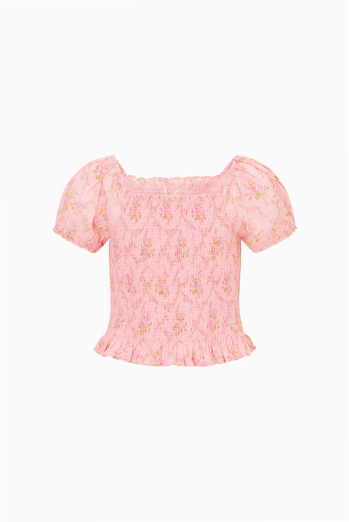 Pink floral tween top with square neckline, puff sleeves, smocked waist, ruffle hem