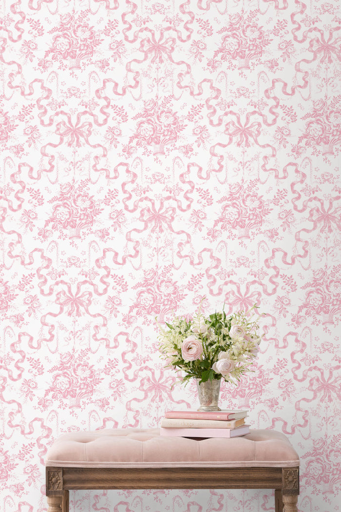 Peony pink toile floral wallpaper with repeating motif pattern on wall