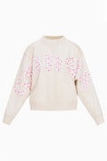 Cream mockneck crew sweatshirt with pink dotted lettering across the front