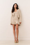 Gold sequin stretch knit cardigan with long sleeves and open front, cropped length