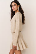 Gold sequin stretch knit cardigan from side view, long sleeves, button front