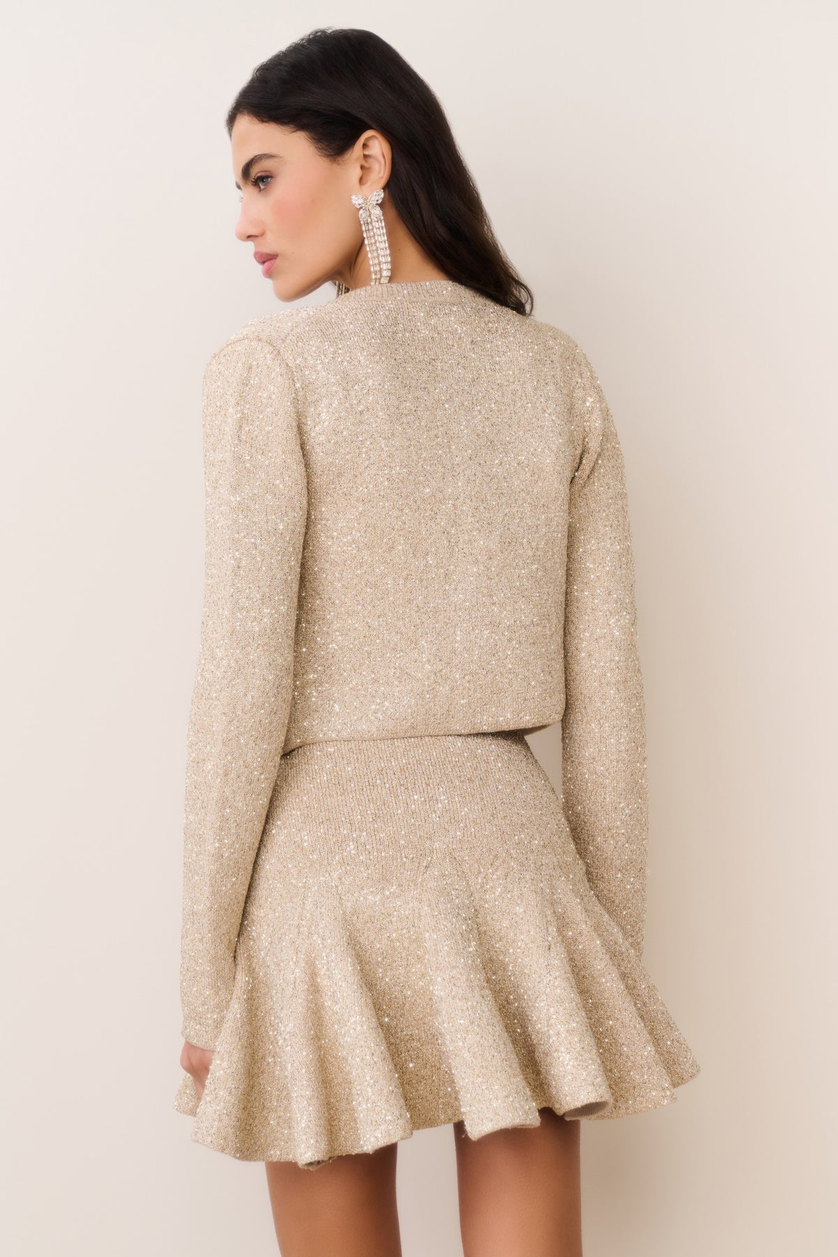 Gold sequin stretch knit cardigan back view, long sleeves, cropped hem