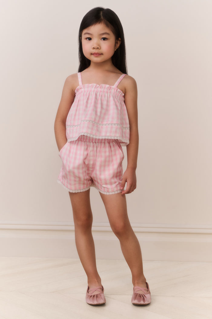 Pink gingham girls' shorts with elastic waist and ruffle-trim hems