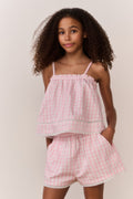 Pink gingham cami top with thin straps and layered ruffle design
