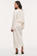 Alabaster crepe maxi skirt with lace trim along hem and side