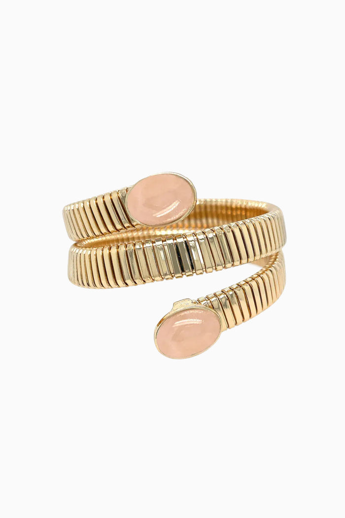 Gold wrap bracelet with ribbed bands and coral resin oval plaques