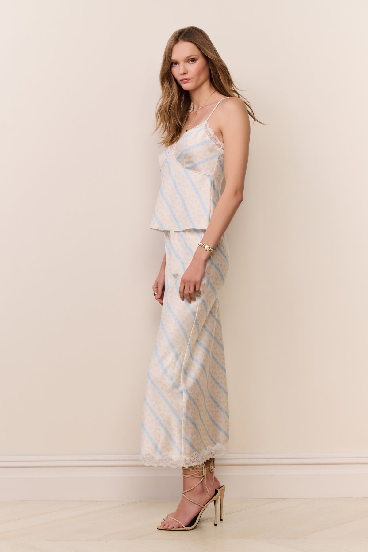 Light blue striped midi skirt with lace-edged hem, fitted silhouette
