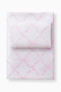 Light pink bow printed sheet set with pillowcases, folded stack on a base