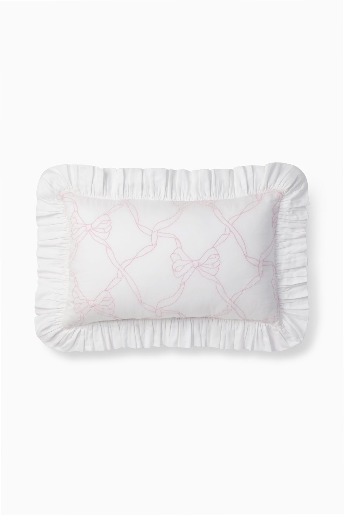 Rosewater throw pillow with ruffled edges and embroidered bow-and-vines design