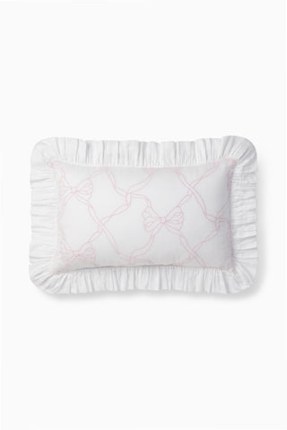 Rosewater throw pillow with ruffled edges and embroidered bow-and-vines design