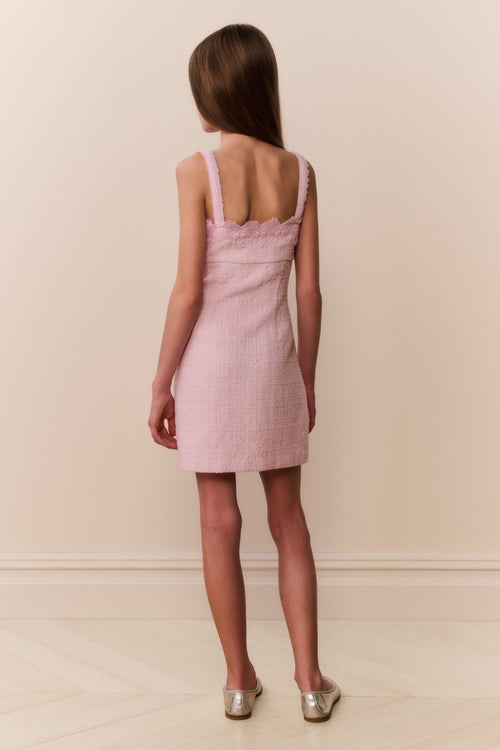 Pink sleeveless mini dress with lace straps and open-back detail