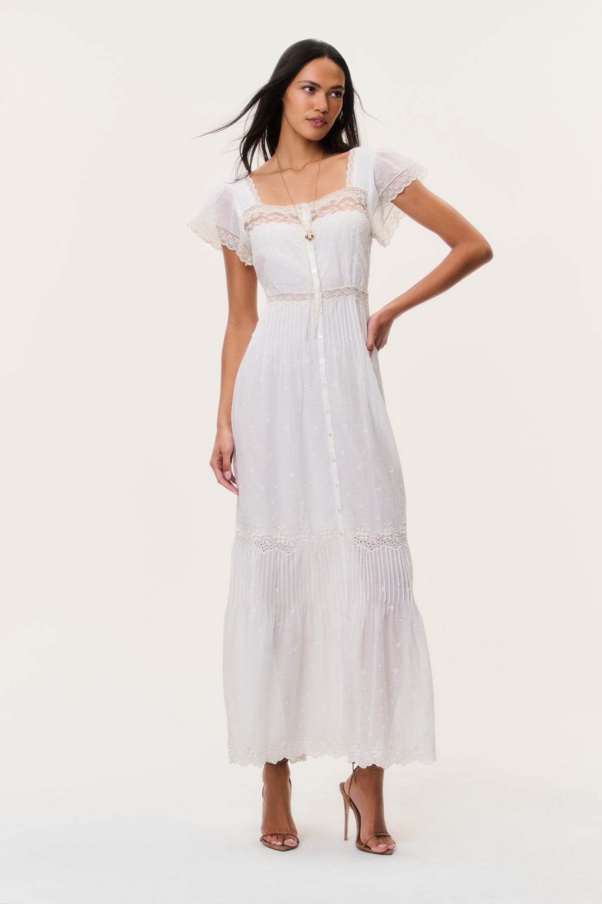 Ivory cotton lace maxi dress with square neckline, cap sleeves, and tiered hem