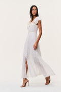 Ivory cotton lace maxi dress with cap sleeves, button front, and sheer hem panels