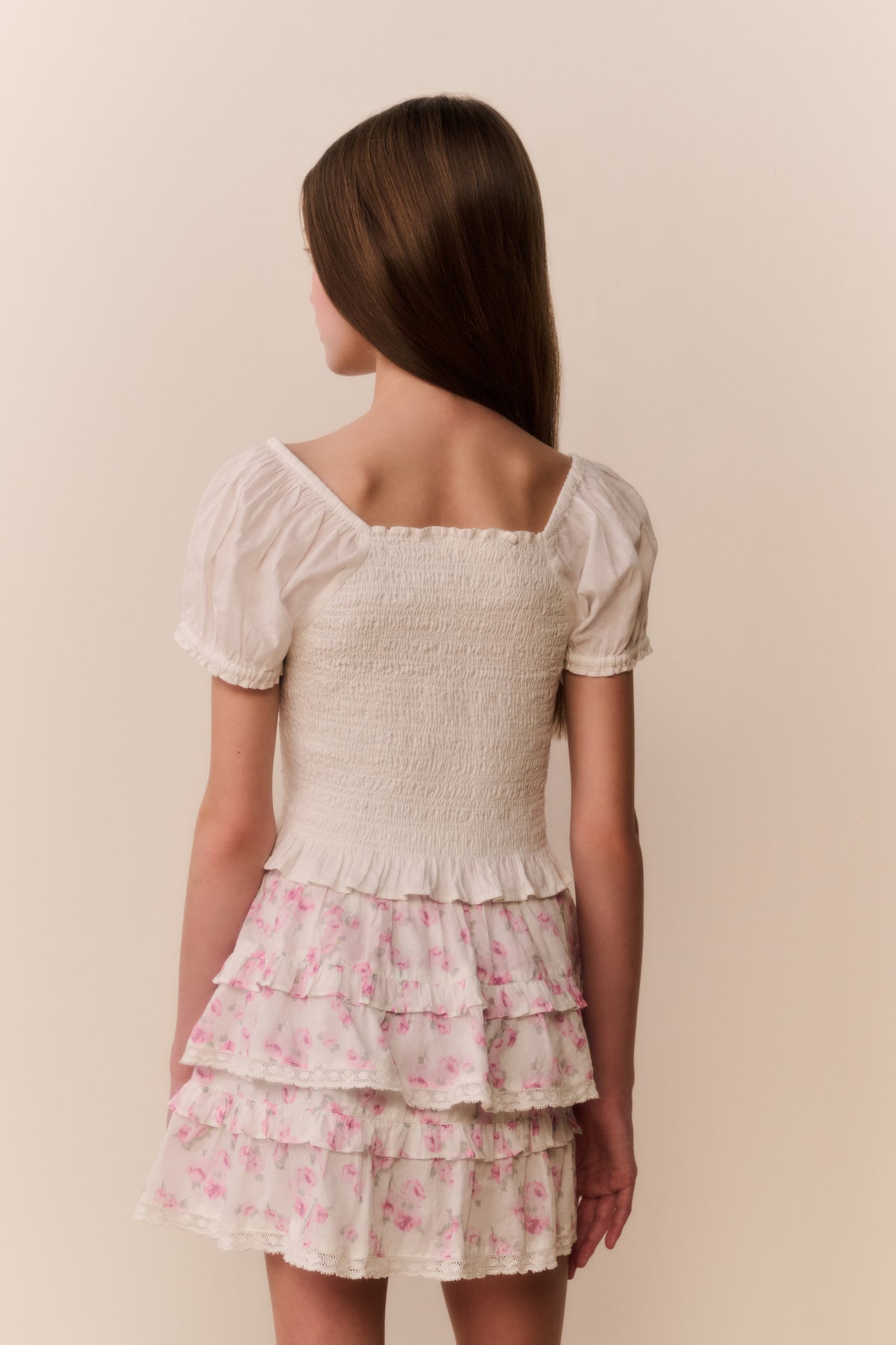 Light pink floral tiered ruffle skirt with layered tiers and gathered hem