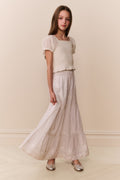 White cotton tiered maxi skirt with gathered tiers and soft woven texture