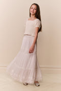 White cotton tiered maxi skirt with ruffled tiers and wide flowy hem