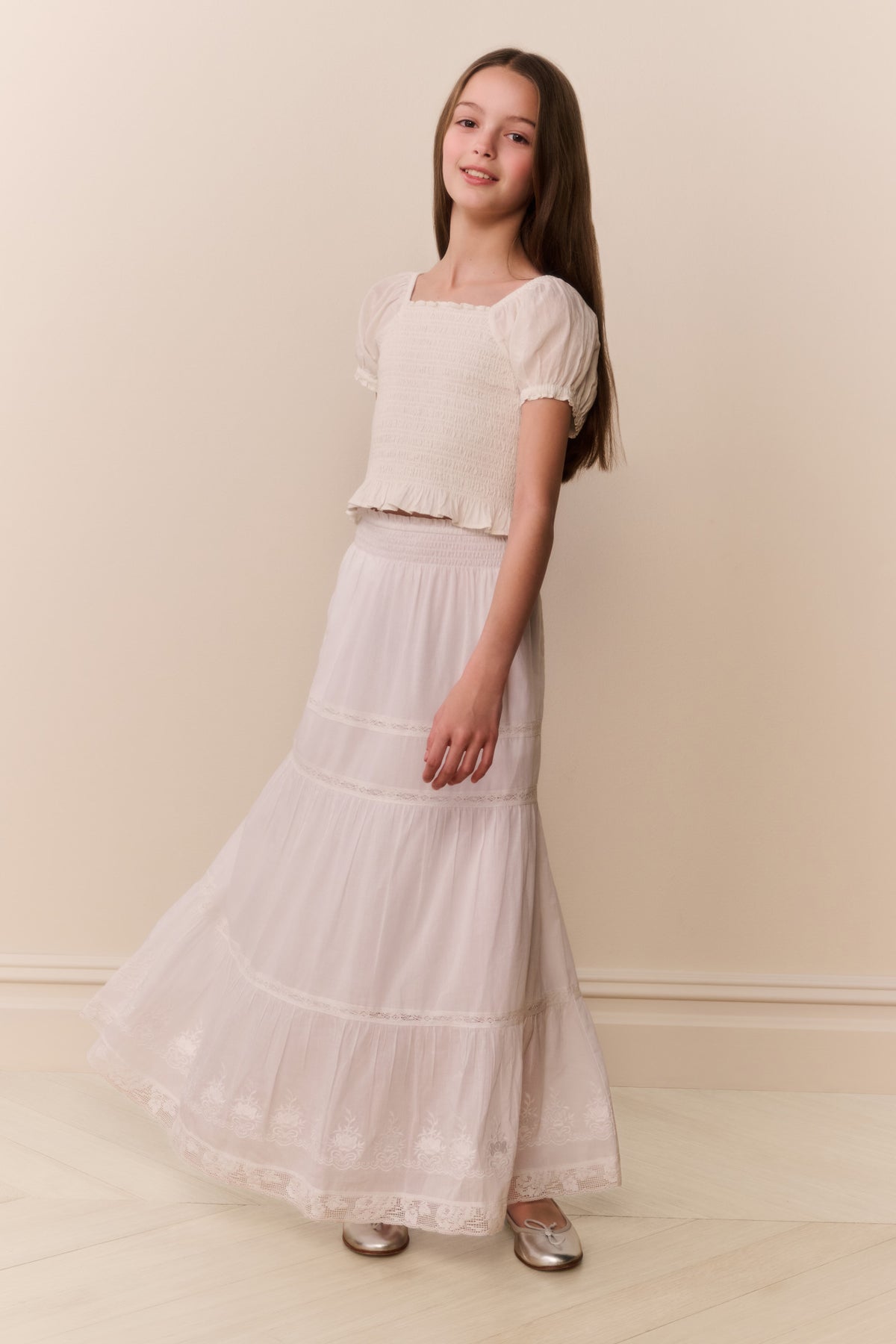 White cotton tiered maxi skirt with ruffled tiers and wide flowy hem