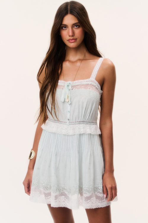 Light blue cotton mini dress with lace trim, spaghetti straps, tassel button-front