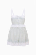 Light blue cotton mini dress with lace-trim bodice, spaghetti straps, tassel button front