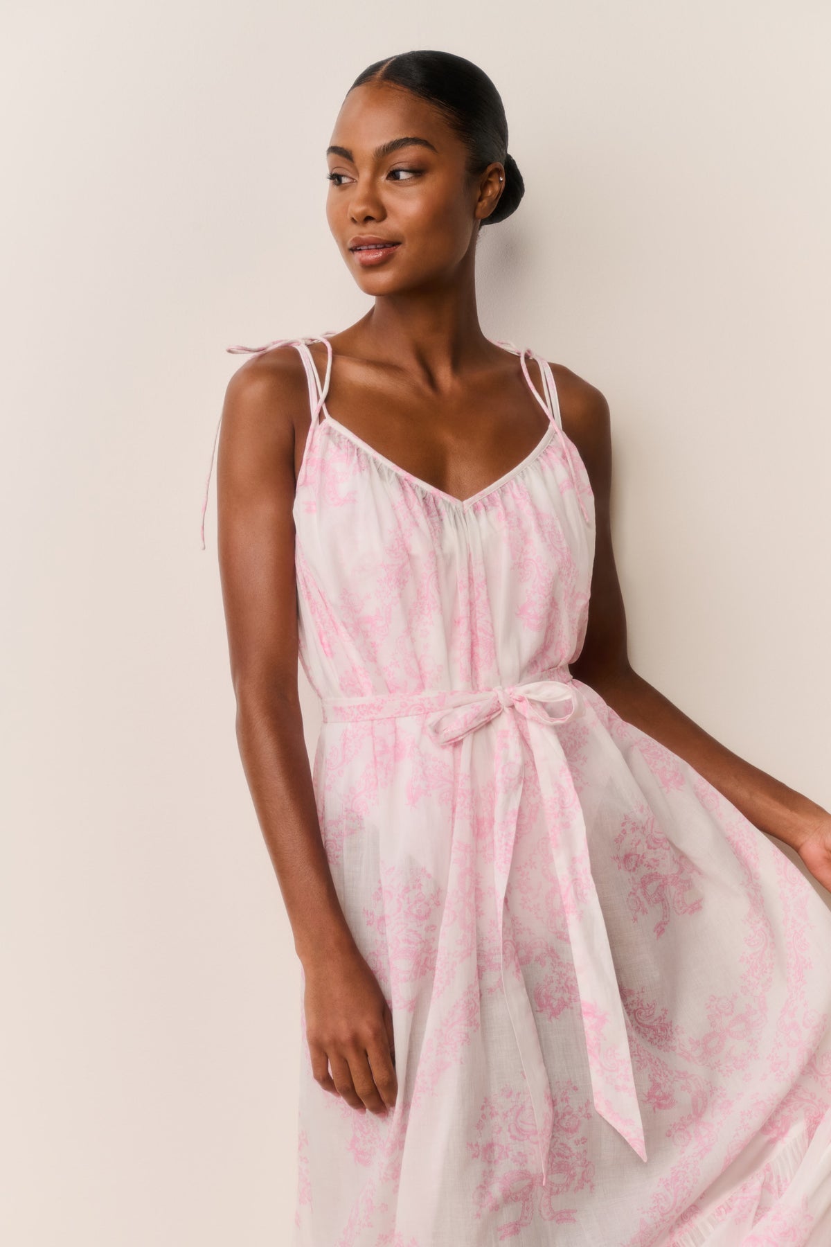 Toile print cover-up dress with thin straps and tie waist, tiered skirt in pale pink tones