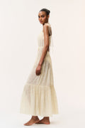 Light yellow cotton cover-up dress side view with spaghetti straps and tiered hem