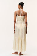 Light yellow cotton cover-up dress with open back, spaghetti straps, and tiered skirt