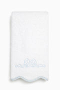 White hand towel with light blue bow embroidery and scalloped trim