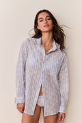 Light blue patterned cotton unisex shirt, button-up collar, long sleeves, front view
