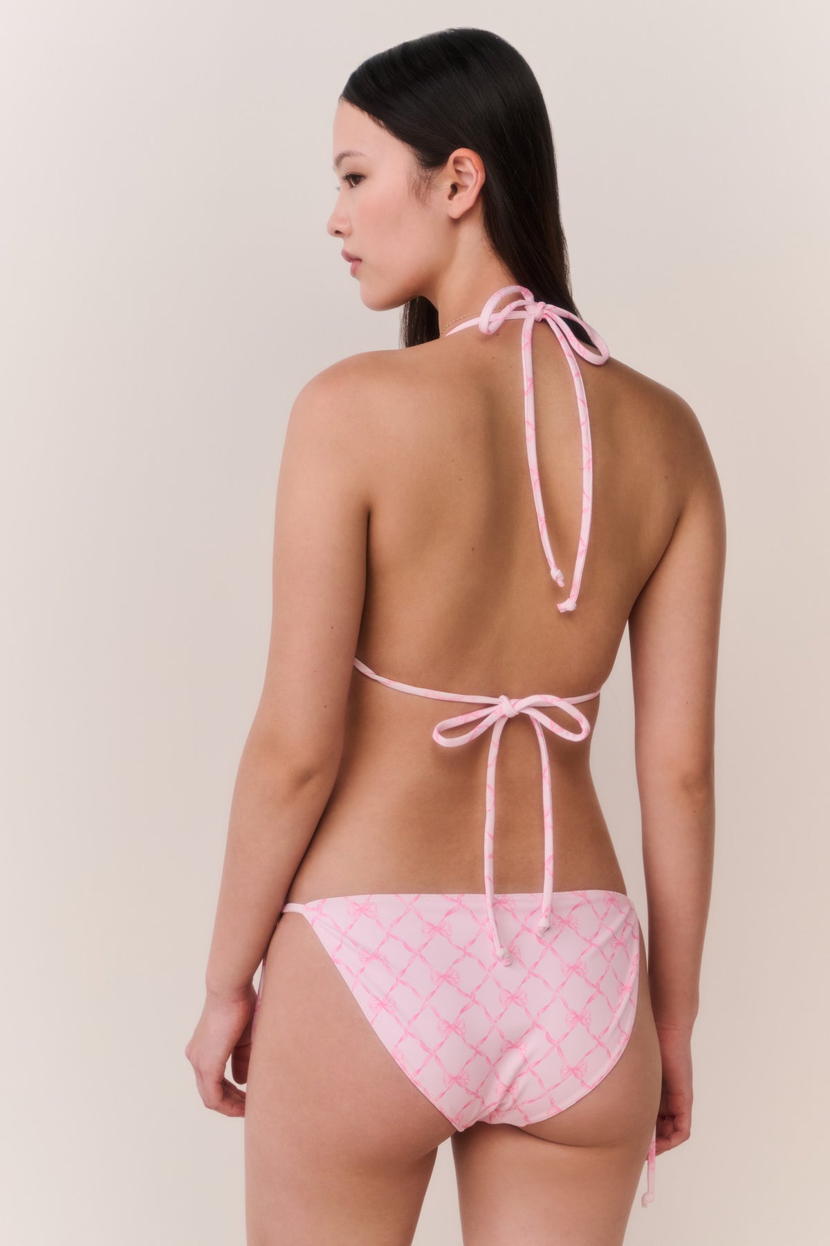 Pink lattice string bikini from back, halter triangle top with tied back straps