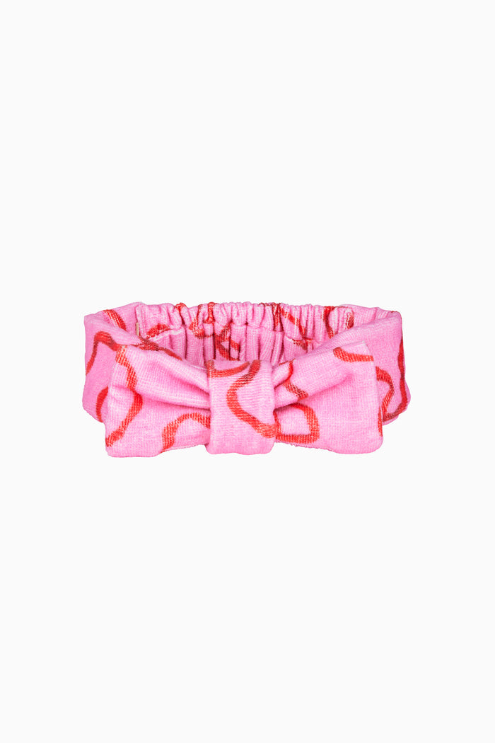 Pink bow print beauty headband with gathered center and top knot