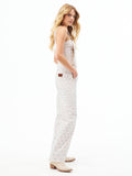 Women’s ecru overall side view with blue micro-print and low back patch detail