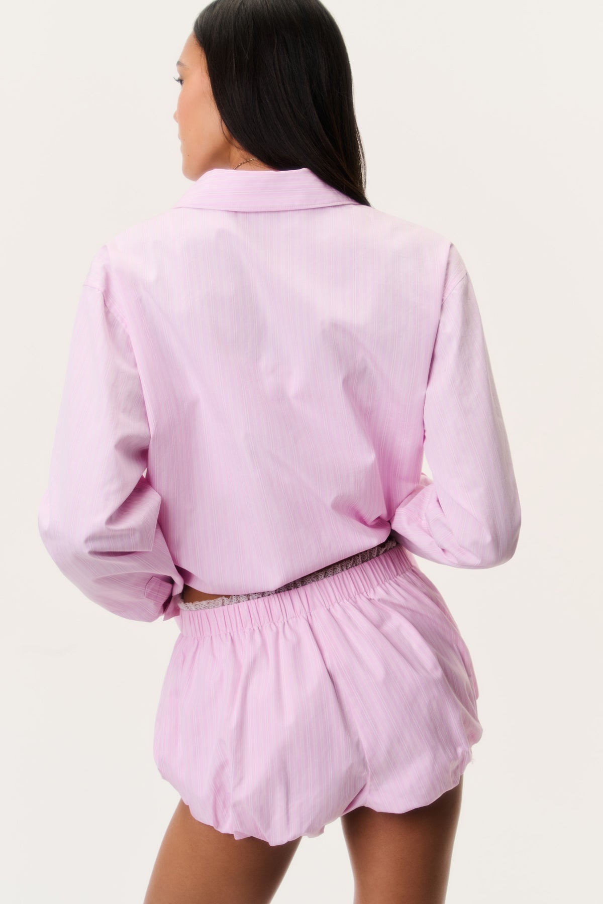 Pink pinstripe bloomer shorts back view with elastic waist and gathered hem