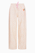 Cream floral-print sweatpants with elastic waist, drawstring, and wide legs
