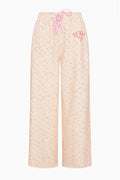 Women’s wide-leg sweatpants with elastic waist and pink drawstring, pale floral print