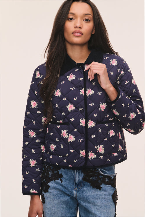 Dark navy floral quilted jacket with full zip and pink flower print