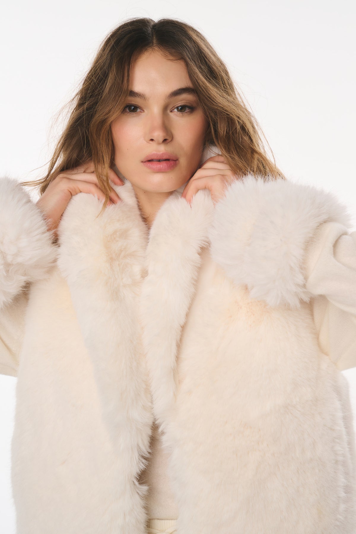 Ivory faux fur vest with thick shawl collar and textured plush finish