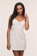 Ivory tweed mini dress with V-neck and scalloped lace trim on straps and hem