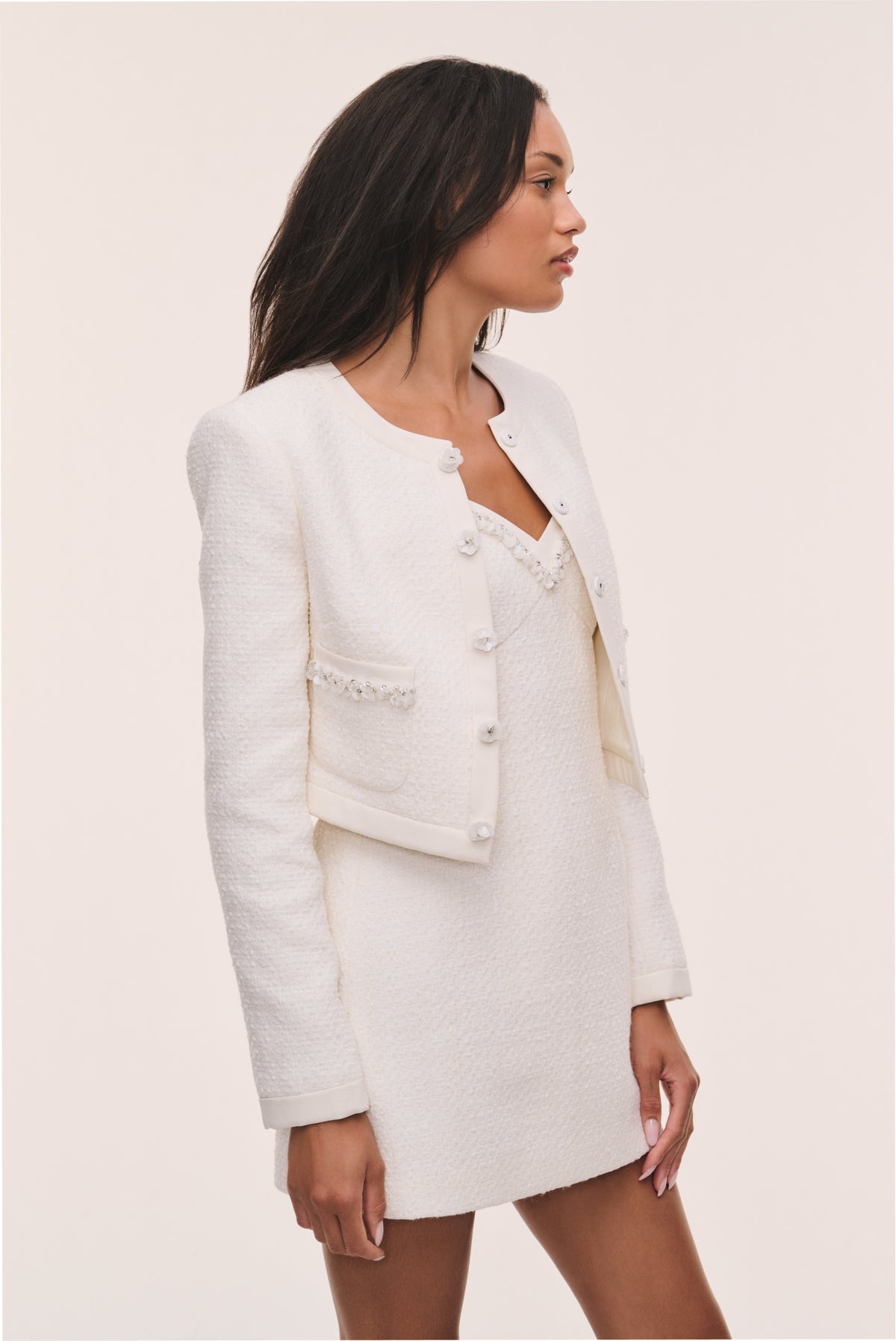 Ivory tweed jacket with button-front and flap pockets, side view, long sleeves