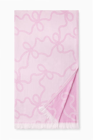 Pink jacquard cotton beach throw with looping medallion pattern and fringe trim