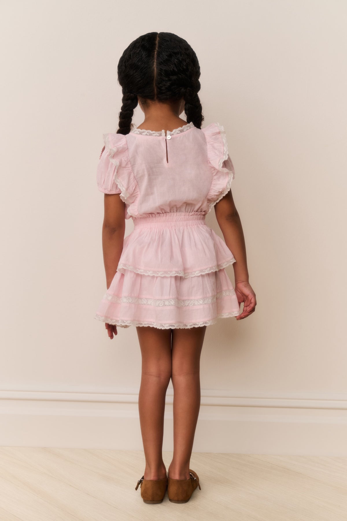 Pink lace-trimmed cotton dress with gathered ruffles and tiered skirt (back)