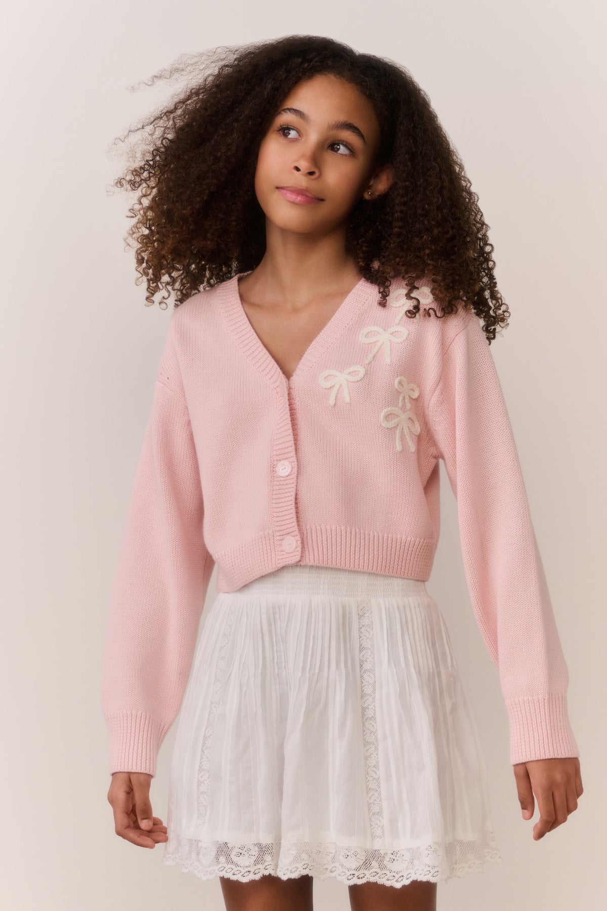 Pink bow-embroidered cardigan, button-front V-neck, ribbed cuffs and hem