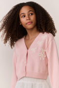 Pink cardigan close-up, bow embroidery on shoulder, button-front V-neck, knit texture