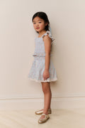 Girls floral cotton mini skirt side profile, light ivory floral print and ruffled hem