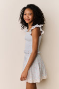 Floral cotton top with ruffled cap sleeves and tiered peplum hem, light blue