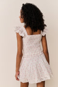 Ivory floral skirt with tiered skirt panels and lace-trim ruffle hem, side view