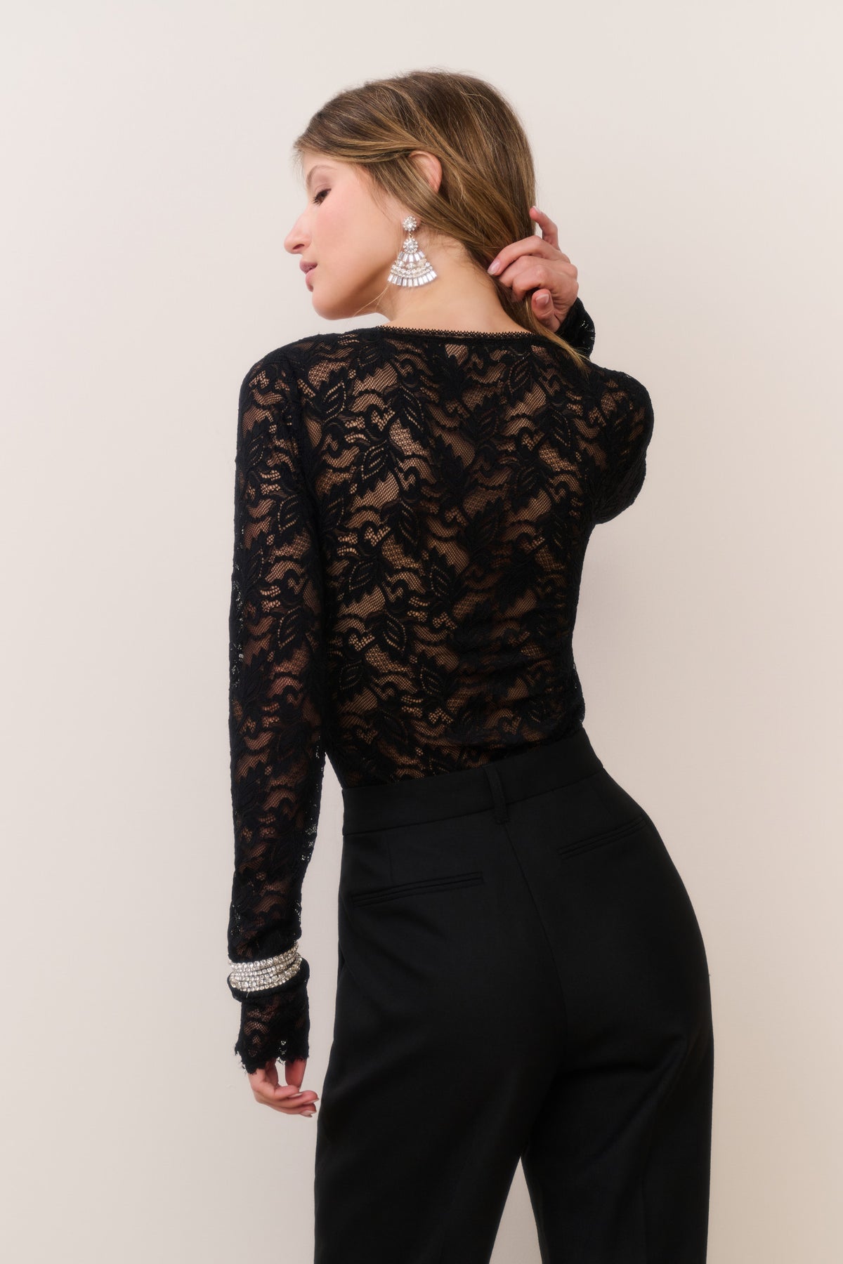 Black sheer lace long-sleeve bodysuit with high back and all-over lace coverage