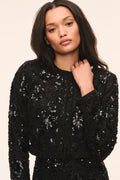 Black sequined cropped jacket with long sleeves, scalloped edges, and open front