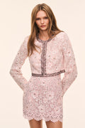 Pink lace long-sleeve jacket with dark pink trim, lace trim accents and sequin embellished floral pattern